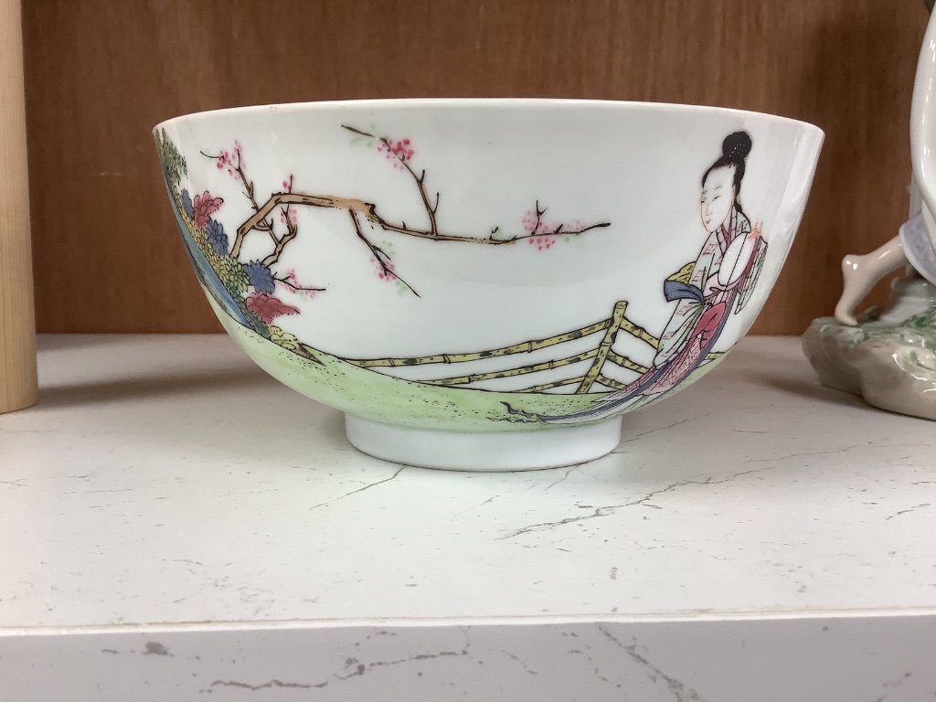 A Chinese blue and white footed porcelain bowl, Kangxi mark to underside, c1900, 12cm diameter 6cm high, together with a further hand painted famille rose, 15cm diameter, 7cm high